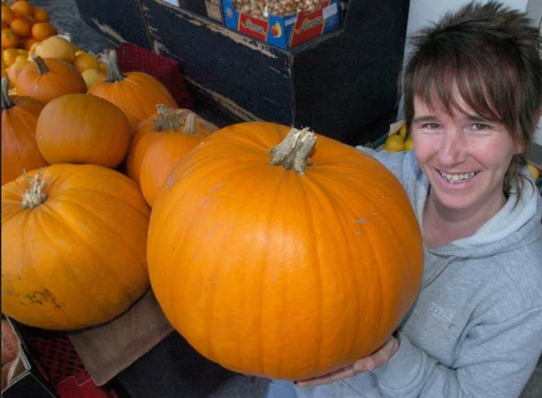 Trisha Birkby from The Greengrocers on Common Garden Street, Lancaster, with some of the large pumpkins ready for Halloween.