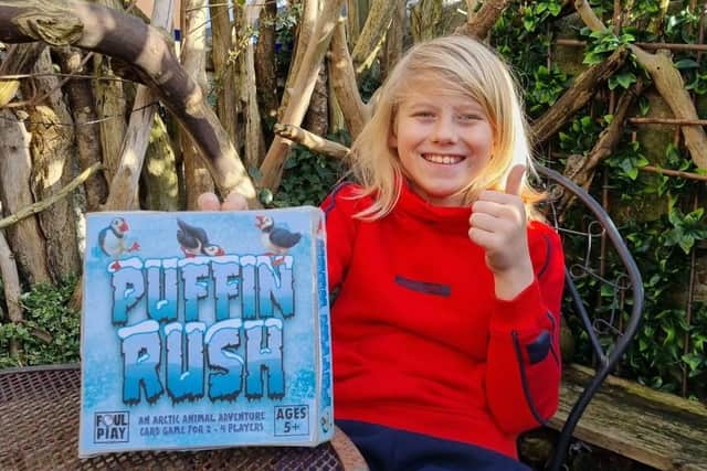 Mason Cooper-Muir with his new game, Puffin Rush.