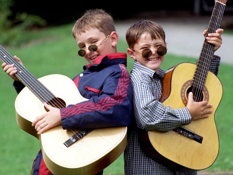 Nathan and Joel Lambert as Liam and Noel Gallagher in a Lancaster Road School Summer Play Scheme talent show held at the school.