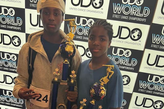 Dylan Dennis, 15, and Leon Dennis, 11, with their trophies from the UDO World Street Dance Championships at Blackpool Winter Gardens
