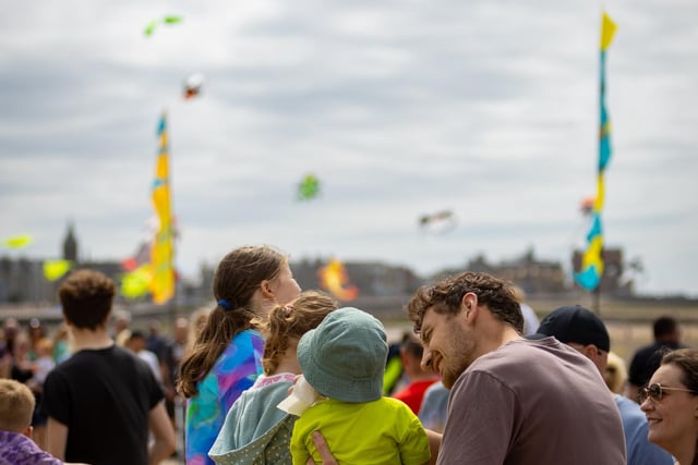 Children enjoying watching the kites at the Catch the Wind kite festival at the weekend. Picture by Jamie Buttershaw.