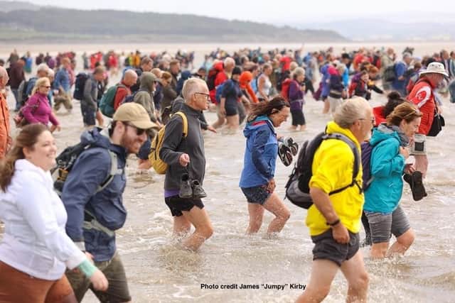 Hundreds took part in the cross bay walk. Photo by James Kirby