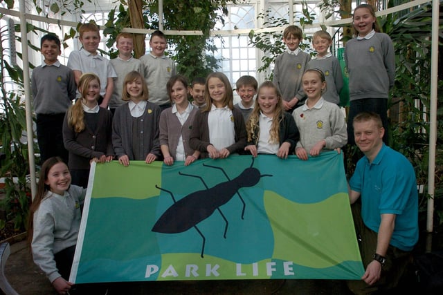 Jessica Macluskie, 11, (front left) and head keeper Tony Astwood with the flag designed by Jessica to mark the reopening of the Butterfly House in Williamson Park. Also pictured are year 6 pupils from Great Wood Primary School.
