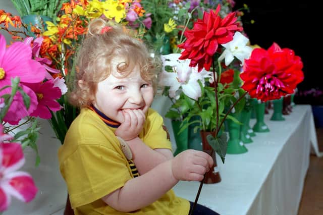 Three-year-old Jaydene Weighell, the grandaughter of treasurer Derek Gardner, at the Galgate Gaslight Floral and Horticultural Society Show in 1998.
