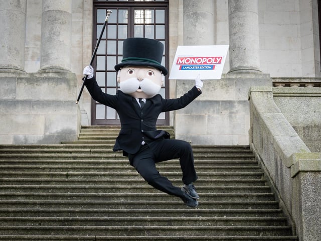 Mr Monopoly jumps for joy at the launch event of Lancaster's edition of Monopoly on the steps of Ashton Memorial in Williamson Park.