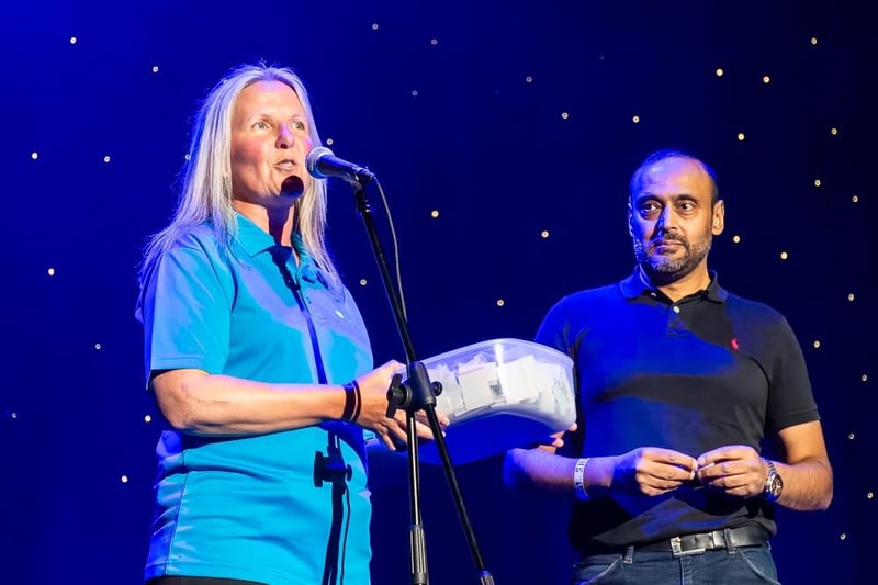 The raffle is drawn during the interval by Catherine Butterworth, director of income generation at St John's Hospice, and event sponsors SQ Digital's managing director Kamal Essa.