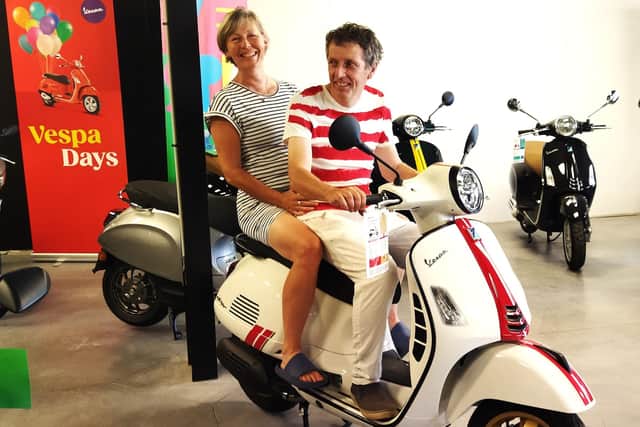 Ann and Tom Algie on a Vespa, recreating the competition entry.