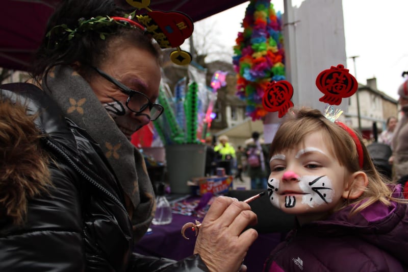 Poppy, age 6, gets her face painted in Lancaster.