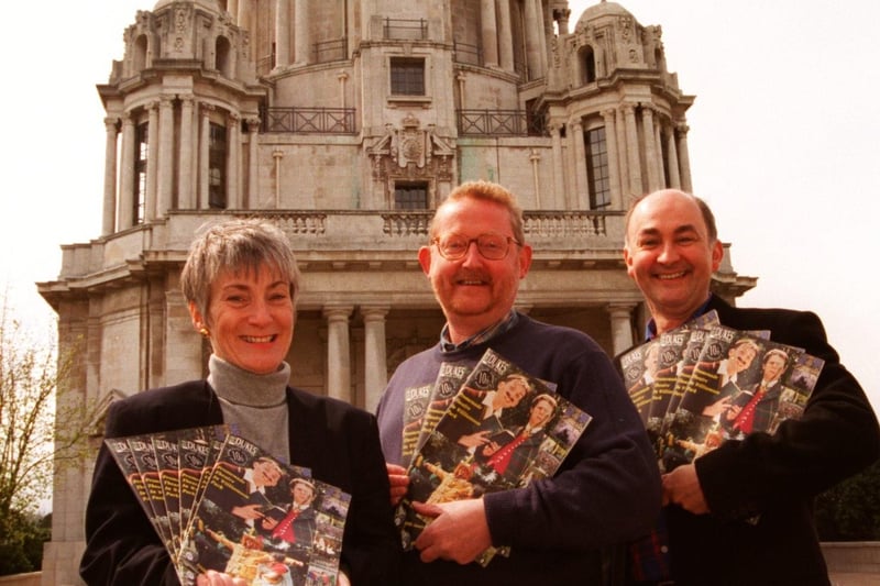 General manager of the Dukes , Penny McPhillips (left), with director Ian Forrest (centre) and cast member John Fleming who appeared in the first prom play in Williamson Park, holding the 10th anniversary brochures.