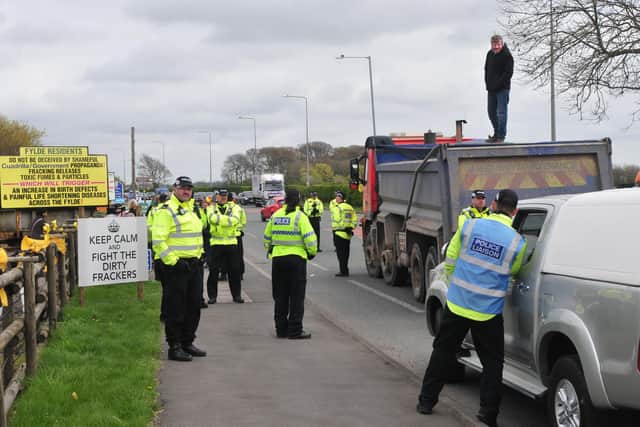A man refuses to come down from the back of a truck in an anti-fracking protest. The Preston New Road fracking site saw a series of long running protests and blockades as anti-fossil fuel campaigners opposed the use of hydraulic fracturing to try to recover natural gas from underground