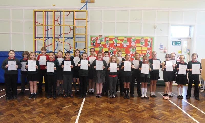 Children from Lancaster Road Primary School in Morecambe with certificates.