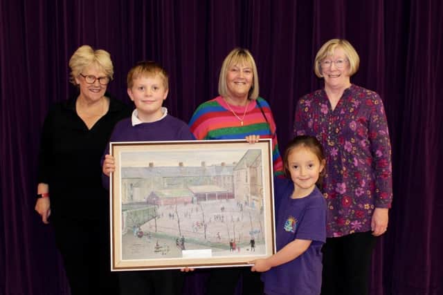 The Old Eustonians present the painting the school pupils.