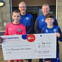 The Lancaster City youth tournament cheque presentation to Rosemere - Alan and Darren at the back with Oliver and Tommy holding the cheque.