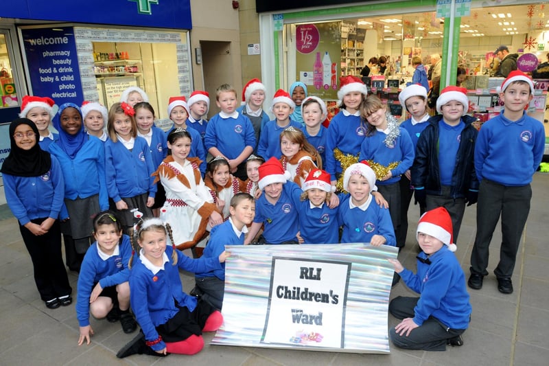 Moorside Primary School Year 4 and Year 6 pupils, who sang Christmas carols in aid of the Children's Ward at the RLI in St Nicholas Arcades.