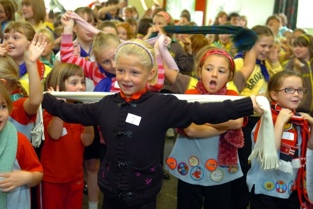 Rainbows, brownies and guides practise their flower power dance at the Garstang Scout and Guide HQ in 2009