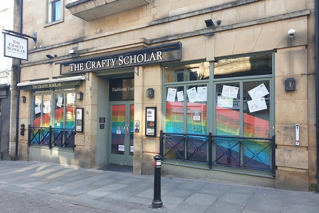 The Crafty Scholar pub put a giant rainbow and messages from schoolchildren in its windows during the first lockdown.