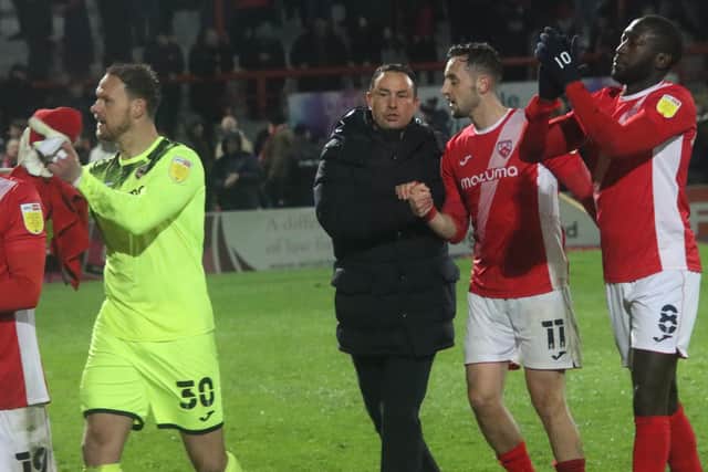 Derek Adams congratulated his Morecambe players after they beat the drop in League One