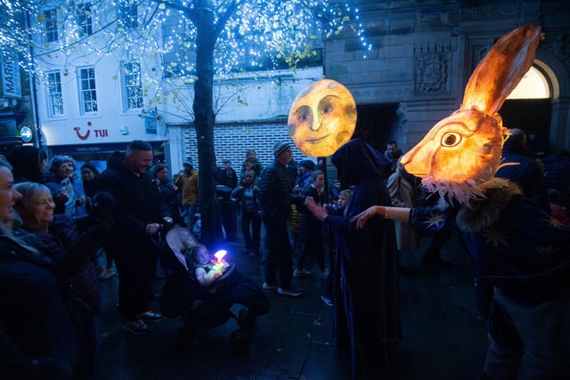 A light up rabbit mask and a sun entertained the crowds at Light Up Lancaster.