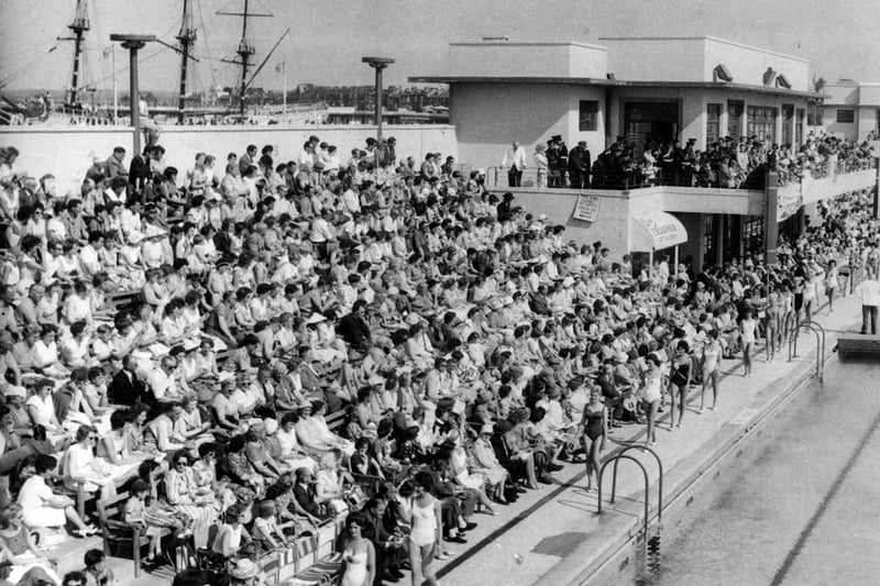 Crowds watch a Miss GB heat taking place at the stadium. The Moby Dick floating ship attraction, which was sadly destroyed by a fire in 1972, can be seen top left.