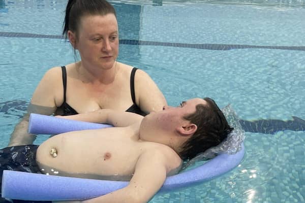 Homecare Assistant Jackie McPherson taking client Xavier Spragg swimming