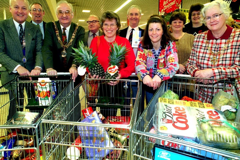 Winner of a Lancaster and Morecambe Lions Club trolley dash, Sue Spencer (centre), with her runner and family friend Jan Pullan (fourth right), other prize winners, Lions president Andrew Dodgson and the Mayor Coun Abbott Bryning at Asda Lancaster.