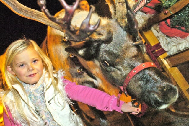 Abigail Richardson with one of Santa's reindeer at the 2008 switch-on in Lancaster.