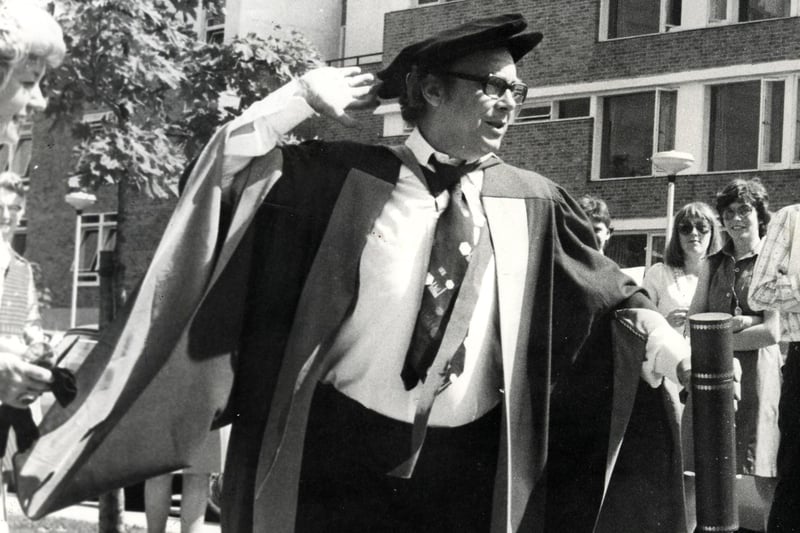 Eric Morecambe strikes his customary pose after receiving an honorary degree in literature from Lancaster University in 1977.