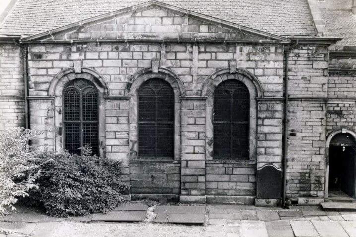 The headstones laid flat c September 1964. Behind the Chapel was a Sunday School -Two of these three visible windows are preserved today. (Lancaster City Museum).