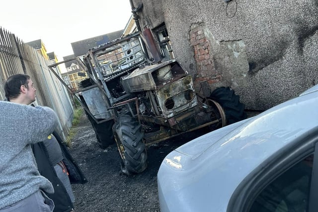 The burnt out tractor on a driveway in Heysham.