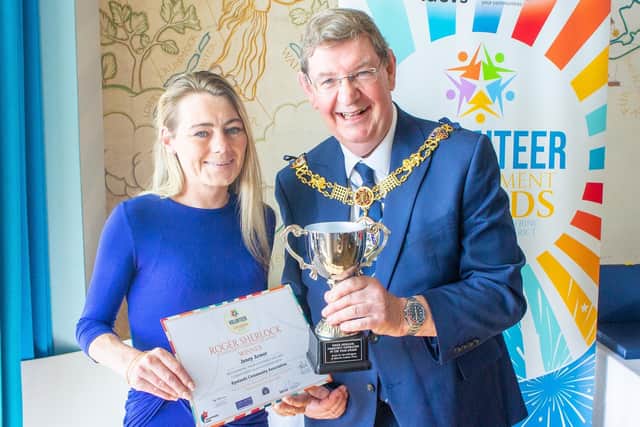 Jenny Armer of Ryelands Community Association receives the Roger Sherlock Community Inspiration Award, presented by Lancaster mayor Coun Roger Dennison. Photo: Steve Dixon/LDCVS