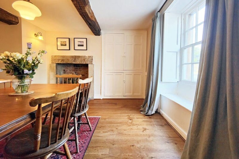 There are window shutters, beams and an alcove cupboard in the dining room.