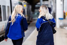 Two female Northern staff members at a station.