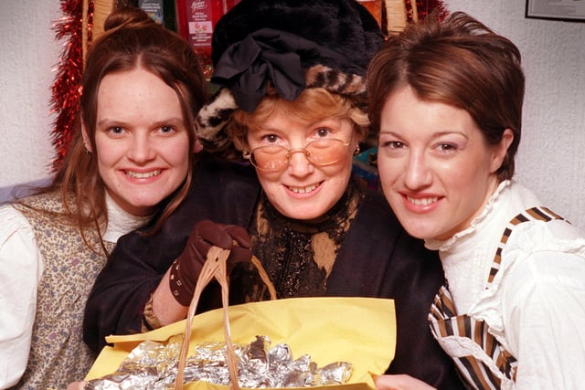 Garstang Natural Health And Beauty Salon's Victorian ladies, from left, therapists Kirsty Rothwell, Patricia Bowden and Helen Flatman serve goodies to shoppers at Garstang's Victorian Christmas Festival in 1999