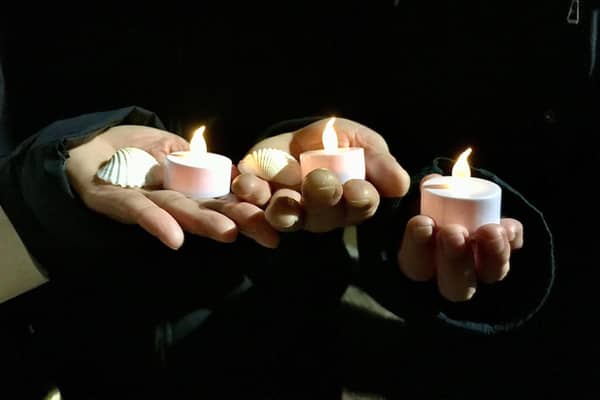 Candles at the memorial event and cockle shells which were handed out for people to take home.