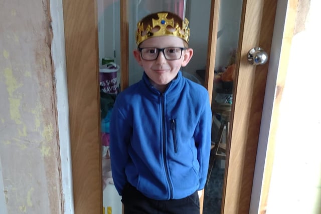 Jack proudly wearing his crown was greeted with balloons and the National Anthem playing, as well as bunting around the gates, when he arrived at school.