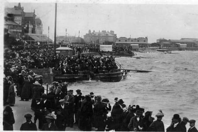 Reader David Pearson supplies this postcard scene of holiday crowds on the sea front at Morecambe. We're not quite sure about the date it was taken, but the weather certainly looks familiar!