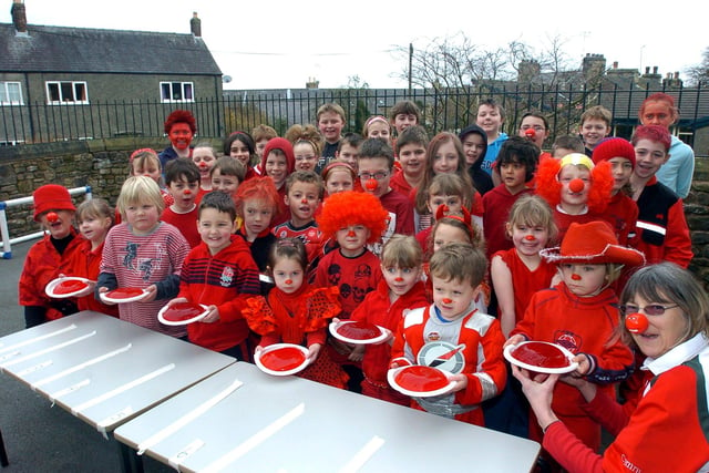 Jellies in hand at Wray Endowed Primary School in 2009 with Mrs Claire Gilham (right), teacher Mrs Alison Wood and pupils lining up at the start of their Comic Relief Jelly Relay around the village.