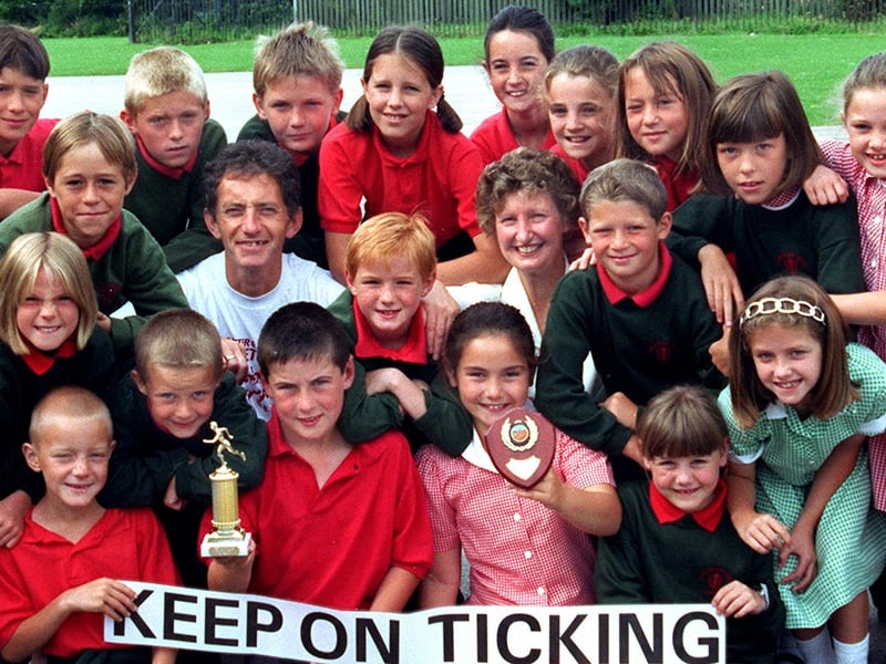 Pupils at Lancaster Road School are presented their trophies for the highest entry in the Keep on Ticking Fun Run by events organiser, Steve Perry and health promotions officer for primary schools, Angela Norris.
