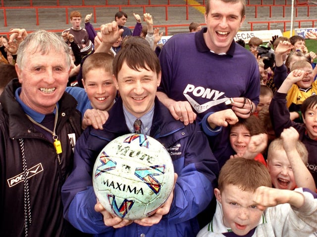From left, coach Shan Gallagher, Kevin Demain representing Morecambe's Football Club's Soccer Schools new sponsor, Heysham Power Station, and coach Tony Hughes.