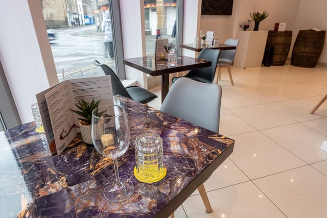A table by the window where you can watch the world go by at Vino's Wine Bar & Restaurant on North Road in Lancaster City Centre. Photo: Kelvin Stuttard