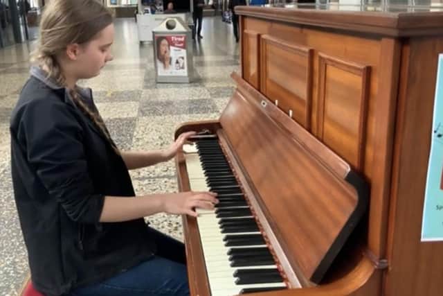 Matilda Walden plays the piano after it returns to Morecambe Arndale Centre.