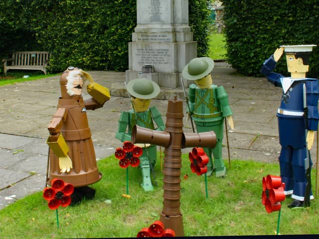 Flowerpots at the war memorial in Settle for the festival.