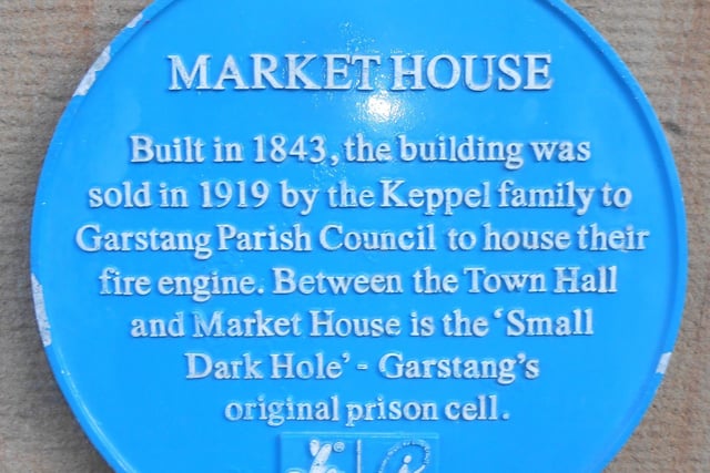 A blue plaque outside Garstang Market House tells of its important historical interest