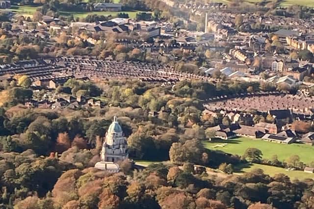 The Ashton Memorial stands out in Williamson Park above rows of Lancaster rooftops.