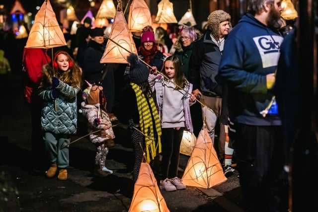 Children holding lanterns in the procession in the West End of Morecambe.