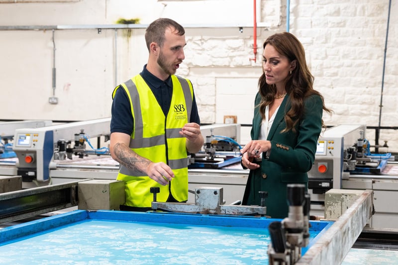 Catherine, Princess of Wales speaks with Nat Craven, department head for finishing product.
