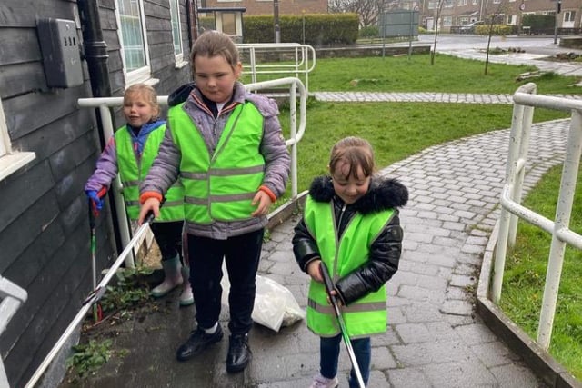 Children from the Ryelands estate in Lancaster with their litter picking equipment.