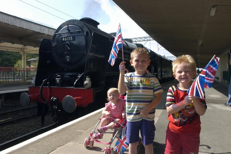Alistair, Oliver and Elsie-Mae welcome the Blackpool special steam train to Platform 2 at Carnforth Station.