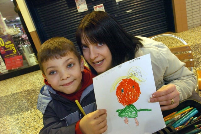 Five-year-old Brandon Dover shows off his finished drawing of mum Maxine at the drawing competition in Morecambe's Arndale Centre. (2009).