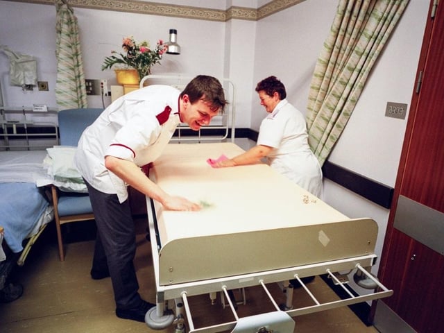 Bed making on ward 23 at the RLI in 2000 when flowers were still allowed in hospitals. Photo by DJ Clark.